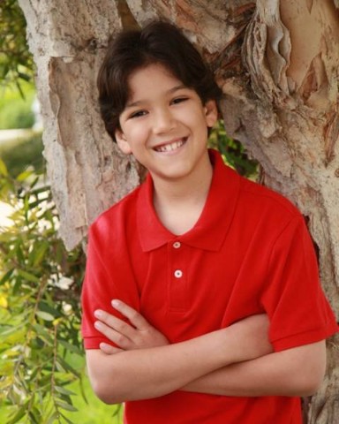 Boy portrait by a tree