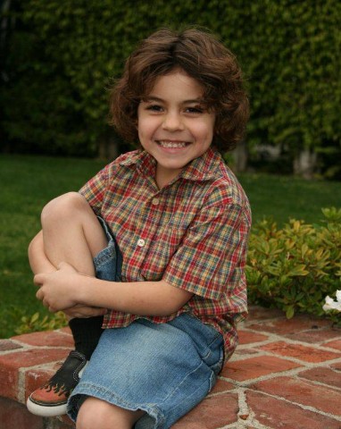 Boy portrait on brick steps