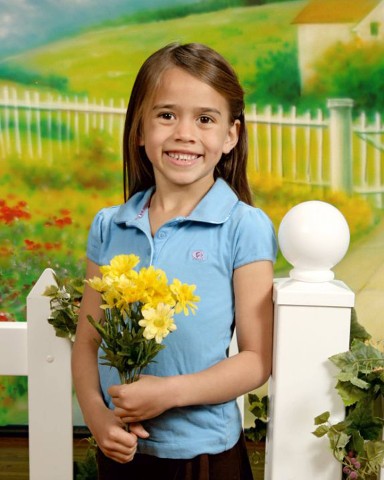 Girl with flowers, garden backdrop