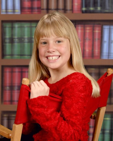 Student portrait, library backdrop
