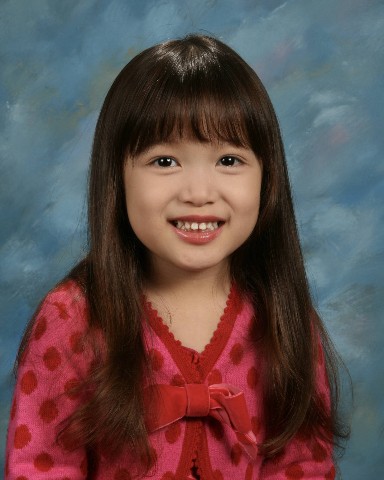 Student portrait, blue backdrop
